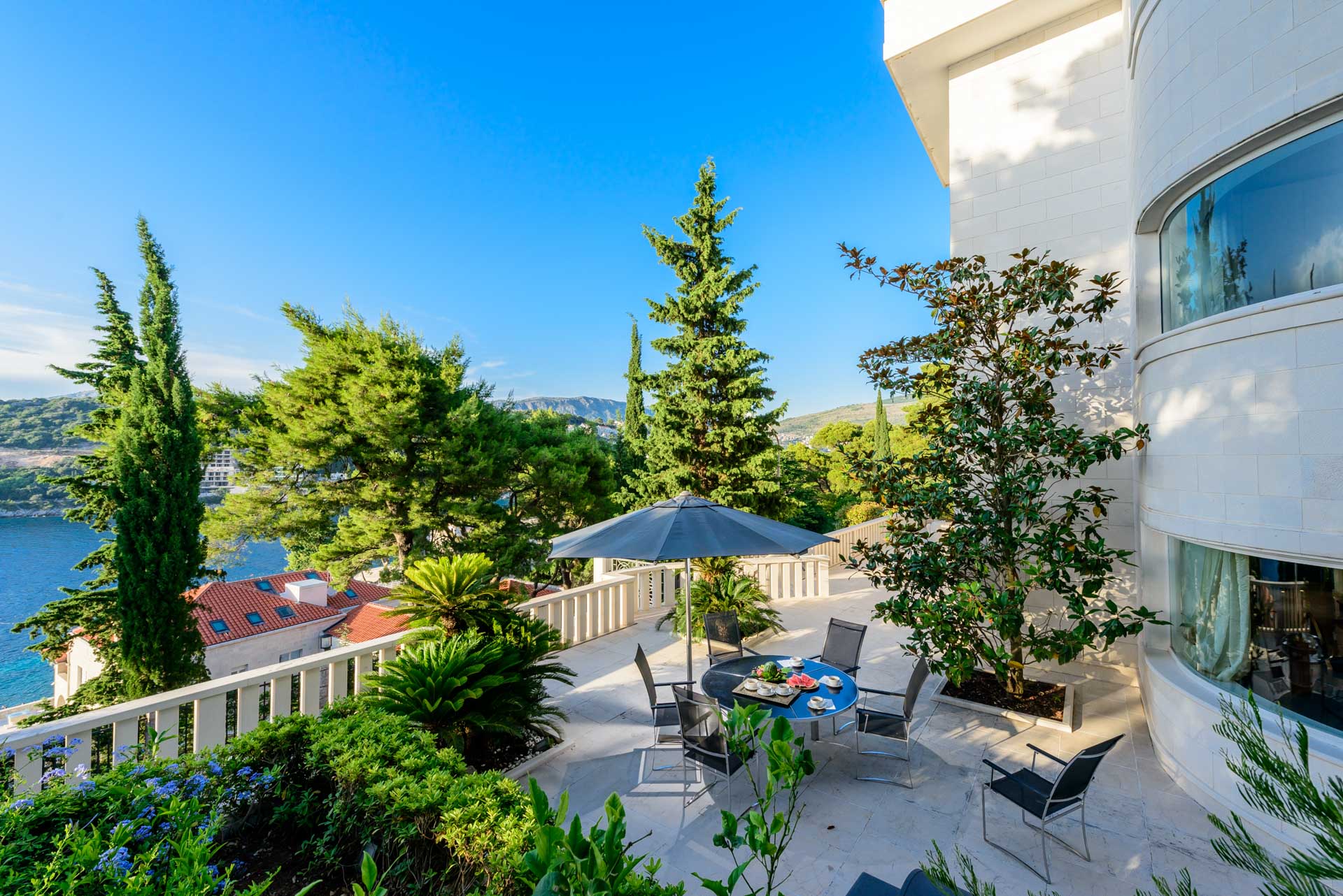 Sea-view terrace with dining area at Villa Royal Dubrovnik in the residential Lapad area, near the coast and away from the busiest part of the Old Town