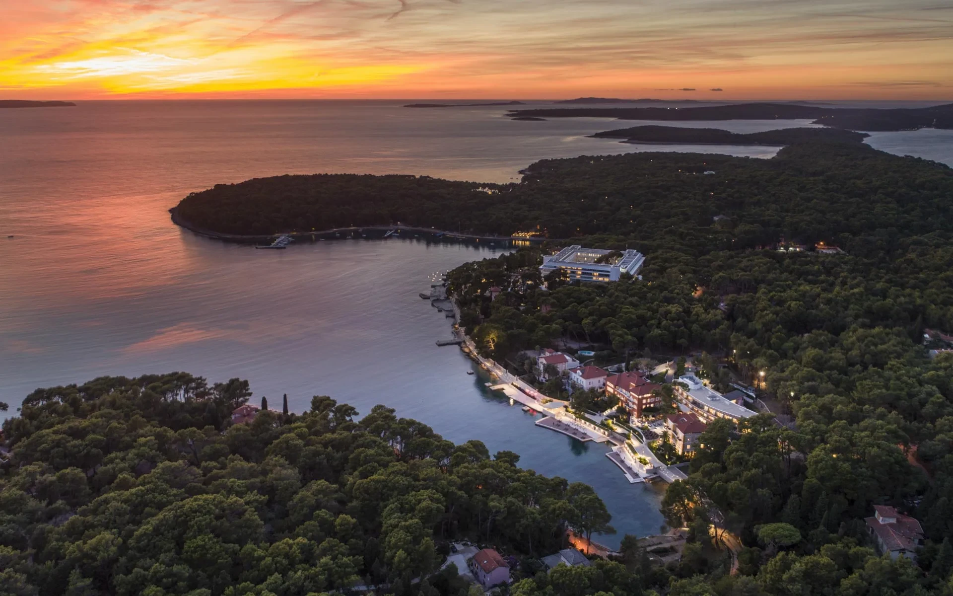 Aerial sunset view of Mali Lošinj bay and pine-covered coastline in winter, near Villa Majesty