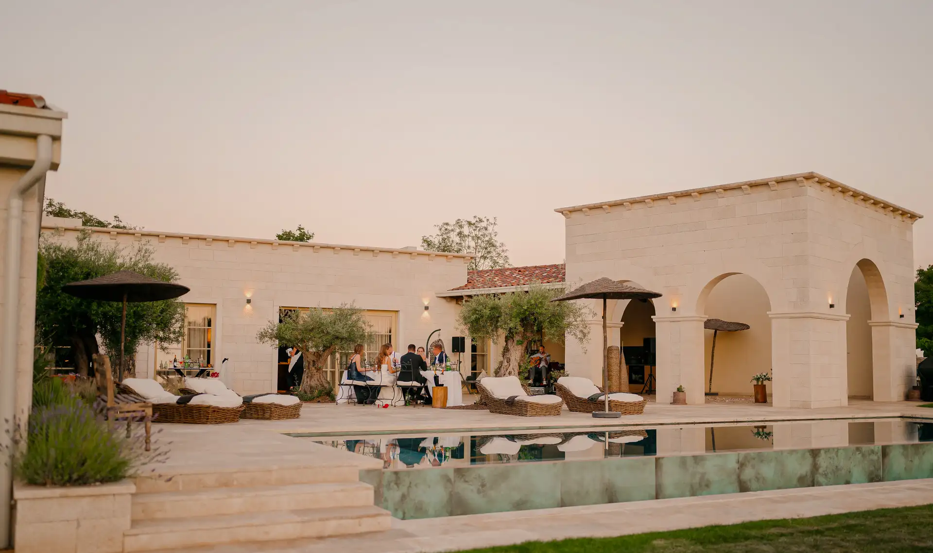 Stone villa terrace with infinity pool and outdoor dining at sunset at Villa Calvia, Sveti Petar u Šumi, central Istria