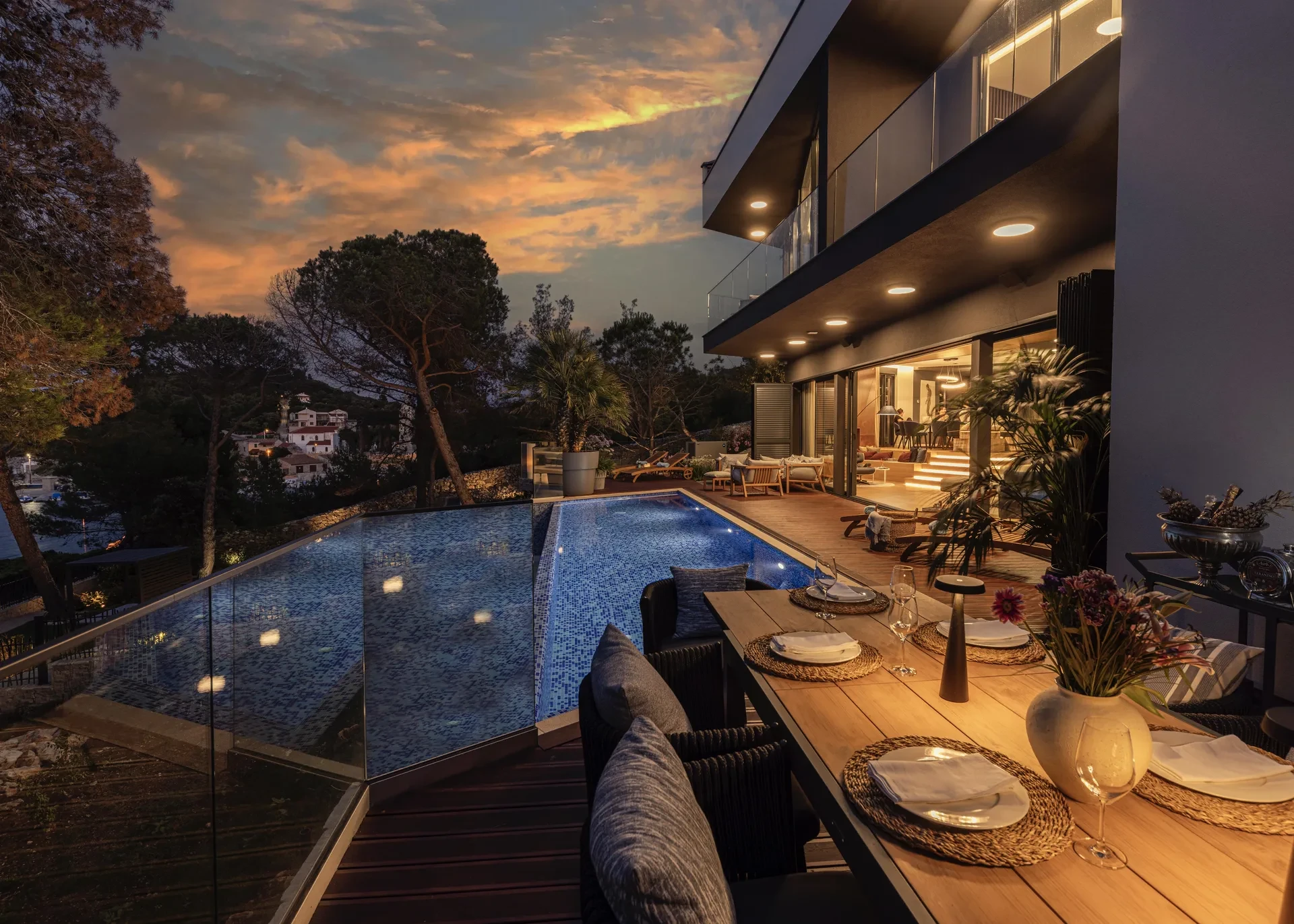 Villa Majesty at night, showing multiple terraces, bedrooms and the pool, on Mali Lošinj