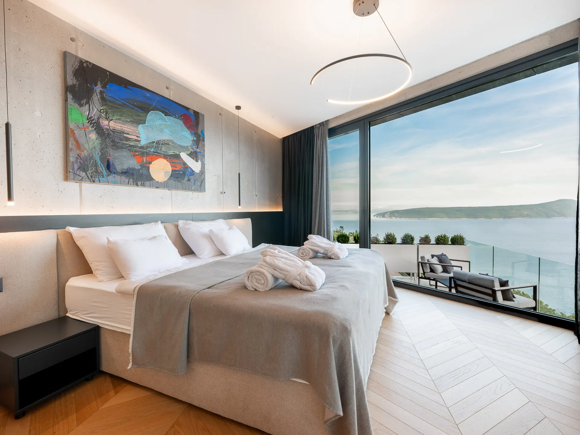Modern bedroom with sea view over Kvarner Bay at Villa Omega, near Opatija on the slopes of Učka