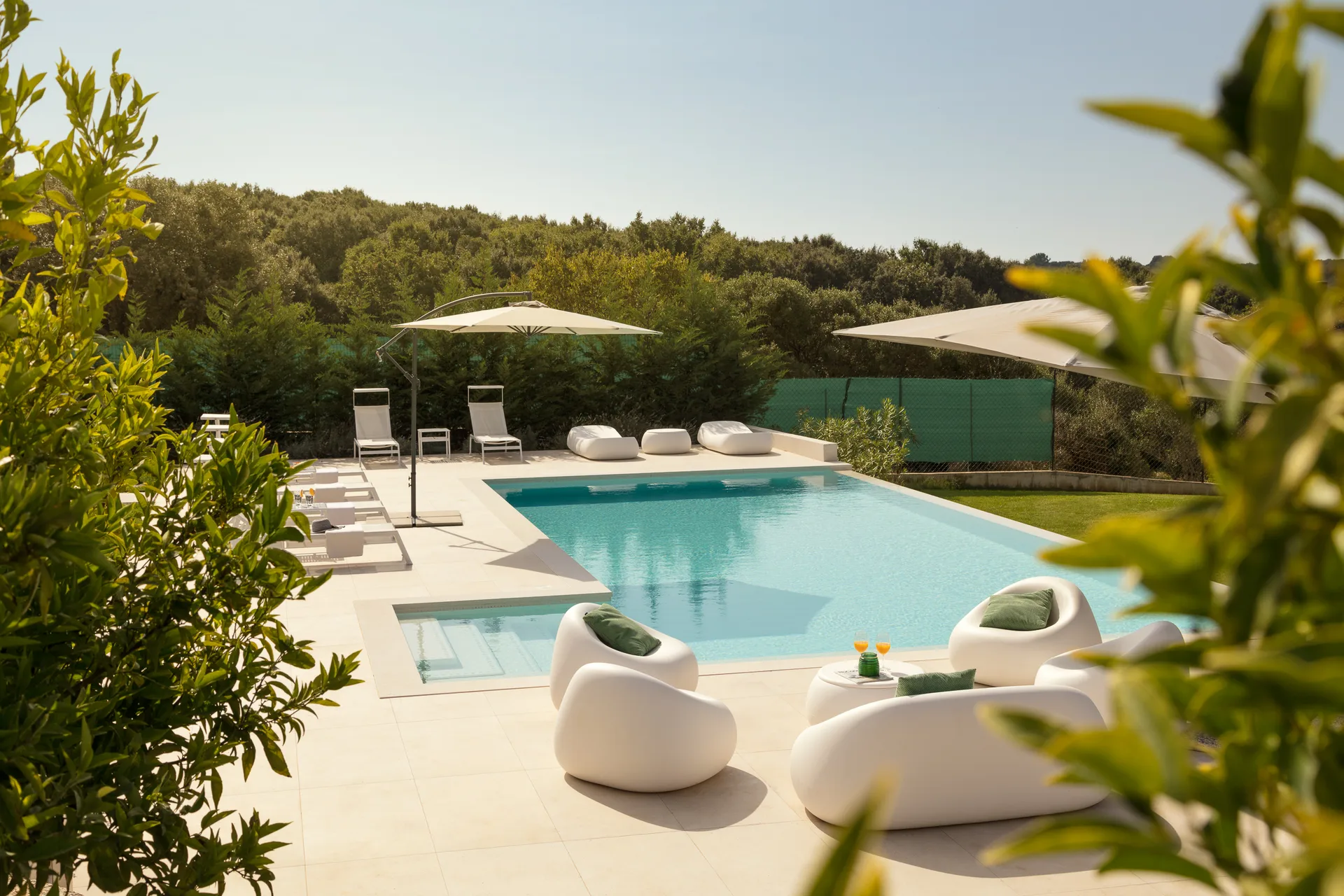 Modern pool terrace with lounge seating at Villa Orion, near Pula, Istria