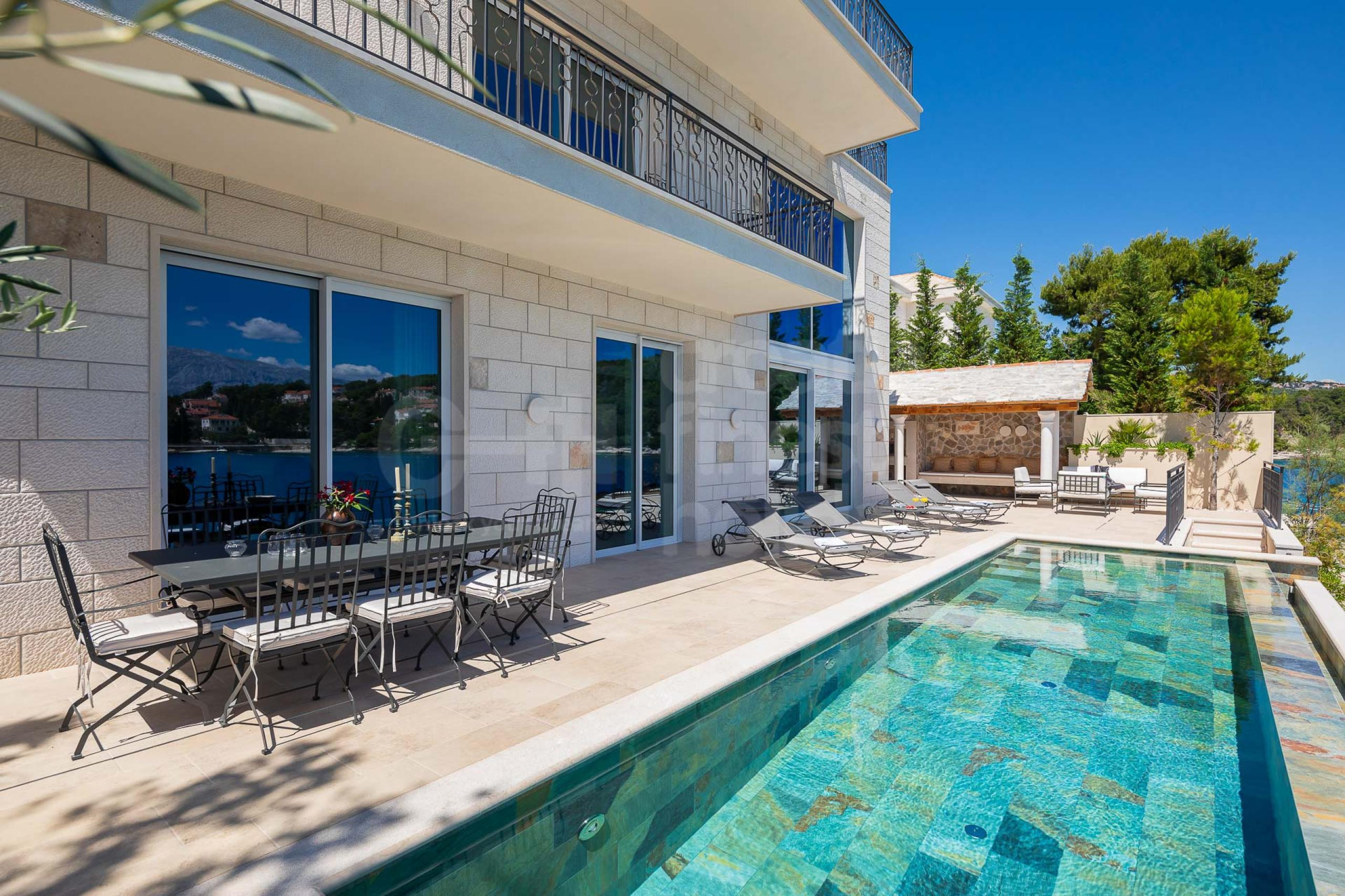 Heated infinity pool by the sea in rental Croatia luxury villa Heda for family vacation