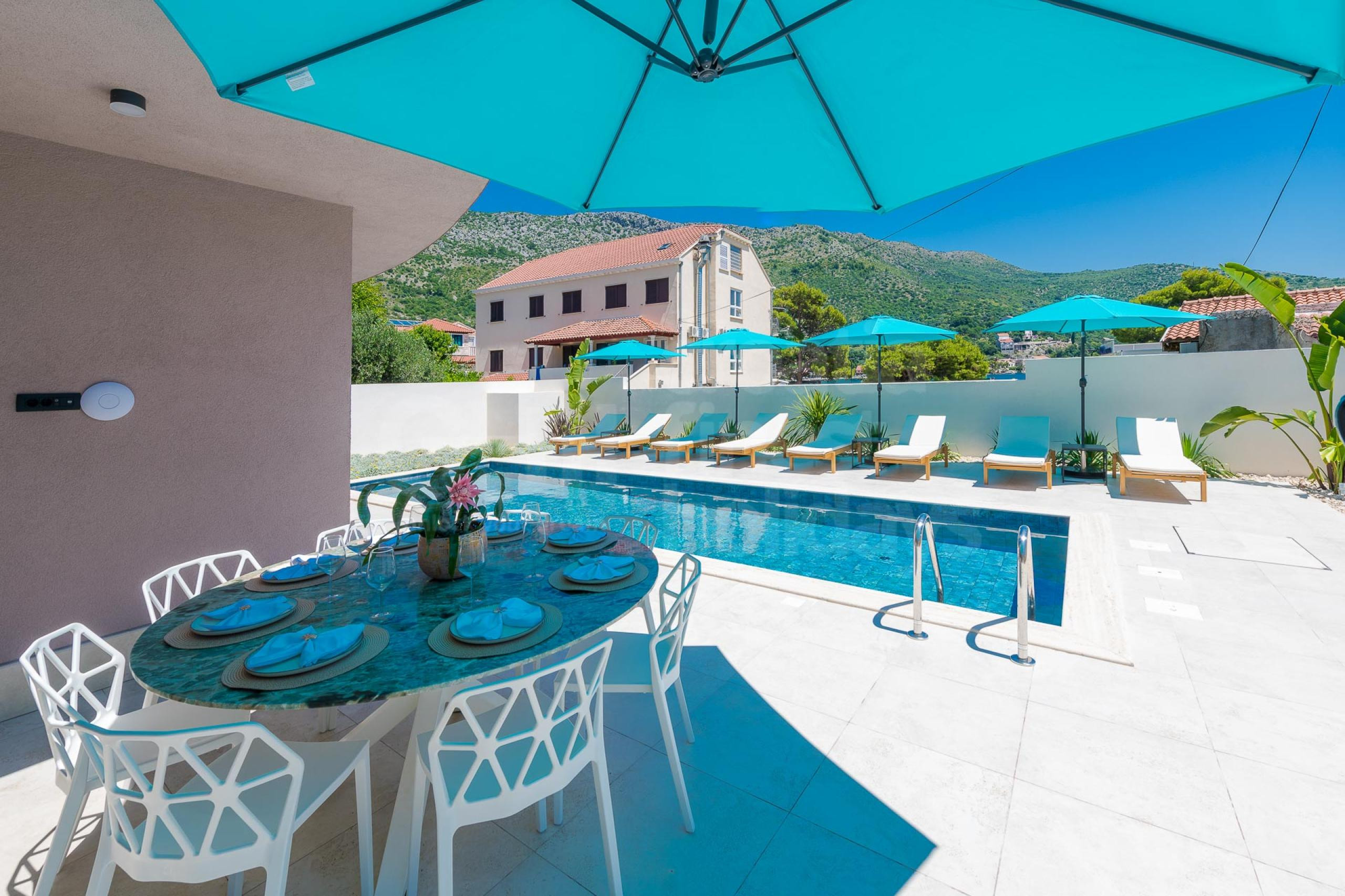 Luxury private villa Dubrovnik Lagoon with outdoor dining area by the swimming pool