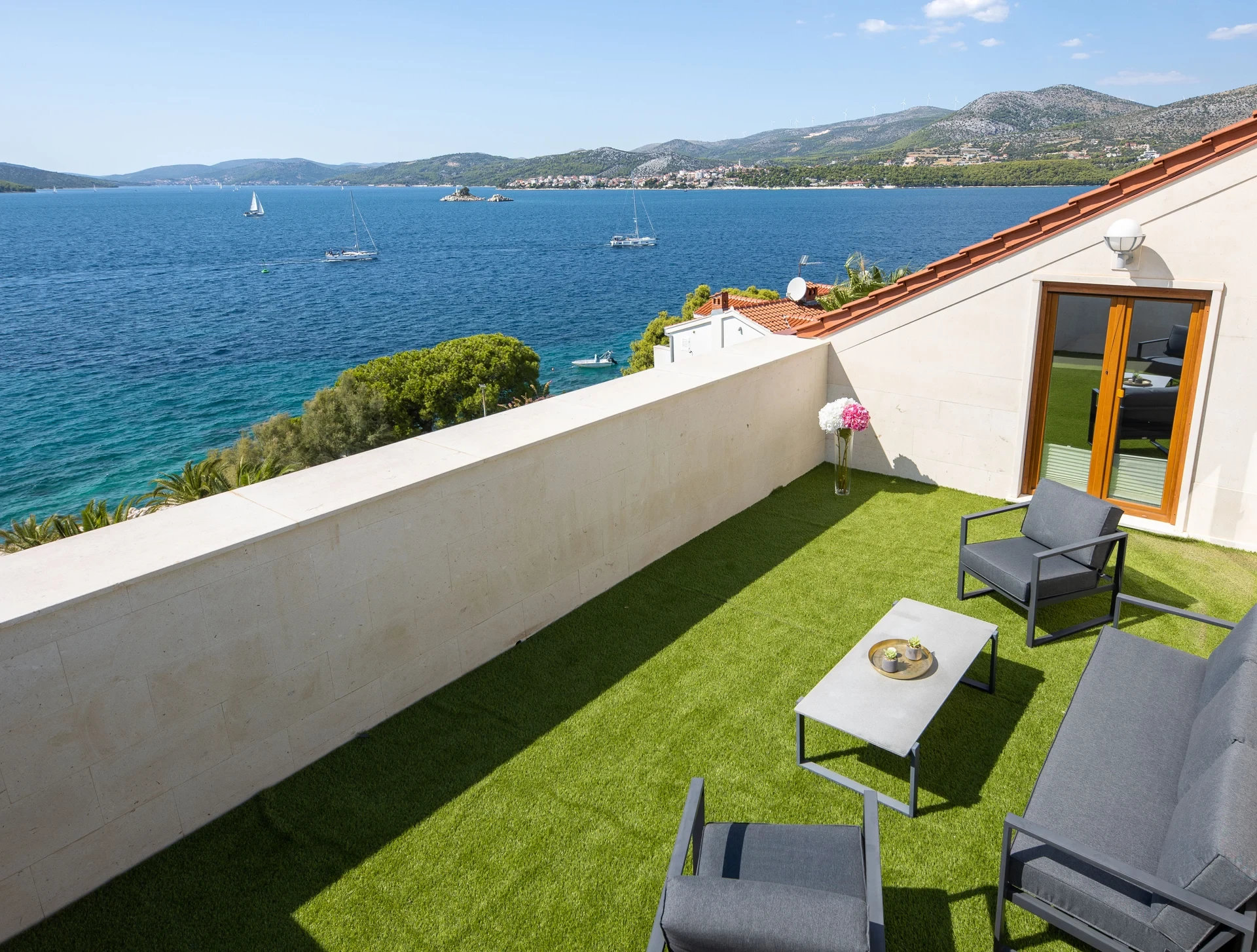 Roof top terrace with loungers and sea view