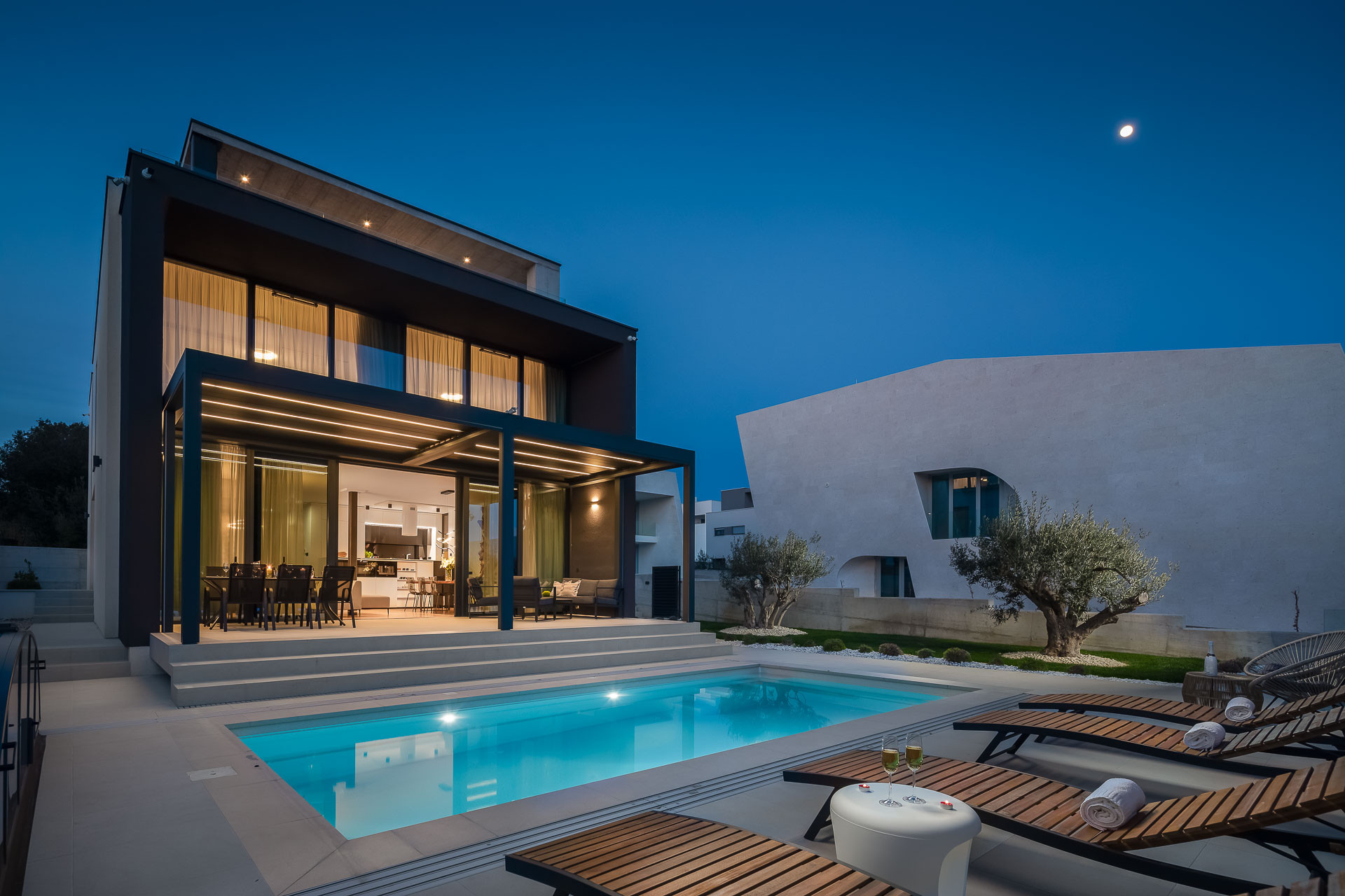 Luxury Villa Happiness with a heated illuminated swimming pool and outdoor loungers in Petrcane Zadar