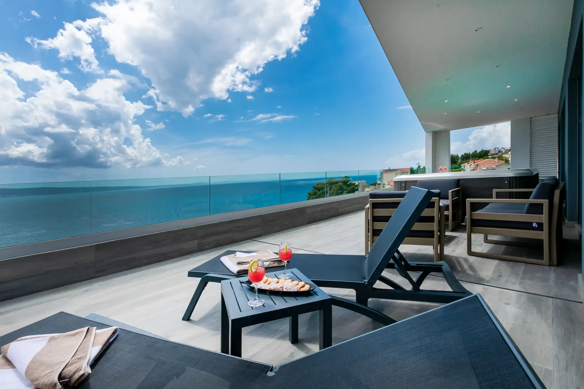 Villa Grande Divina near Split with sun loungers on terrace and sea view