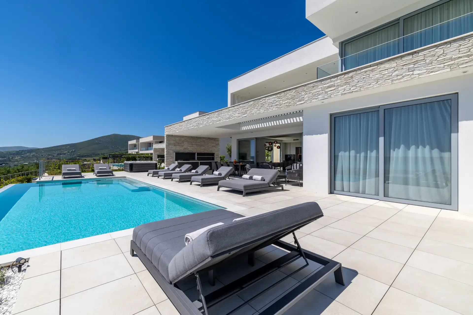 Contemporary design of Villa Nikita in Split with a swimming pool and inviting area for relaxation.
