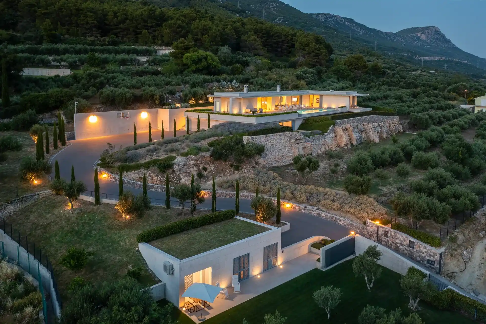 Exterior night view of Luxury Villa Floora with private heated pool, sea view and game room