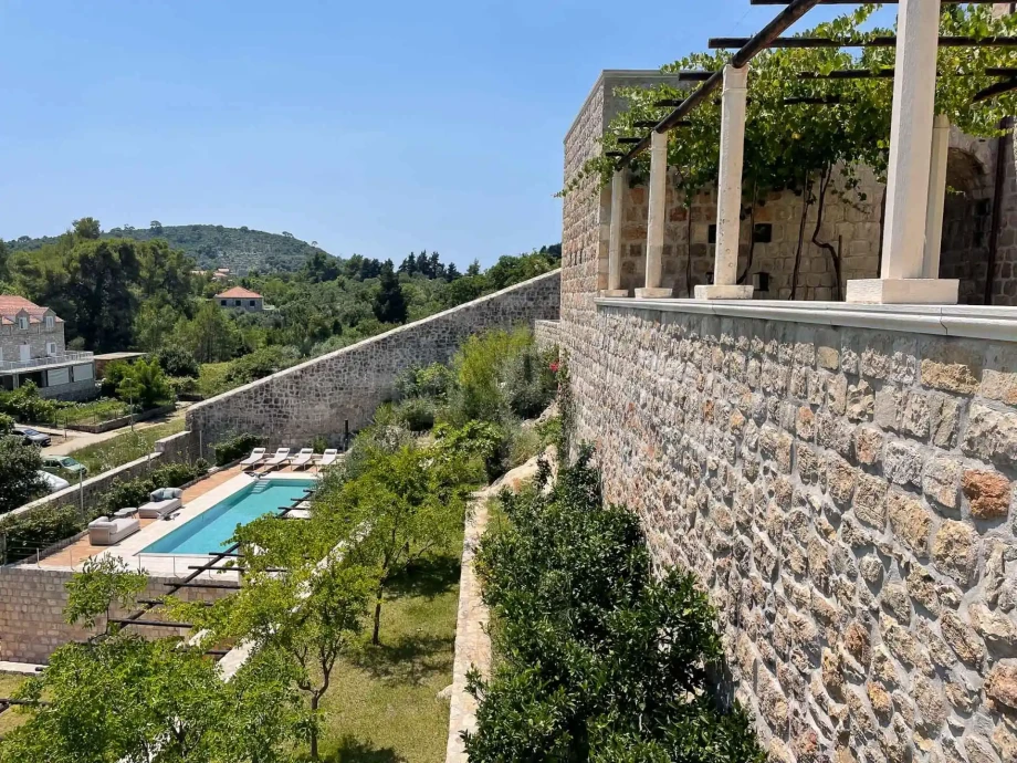 Private swimming pool below the historic stone residence in Croatia