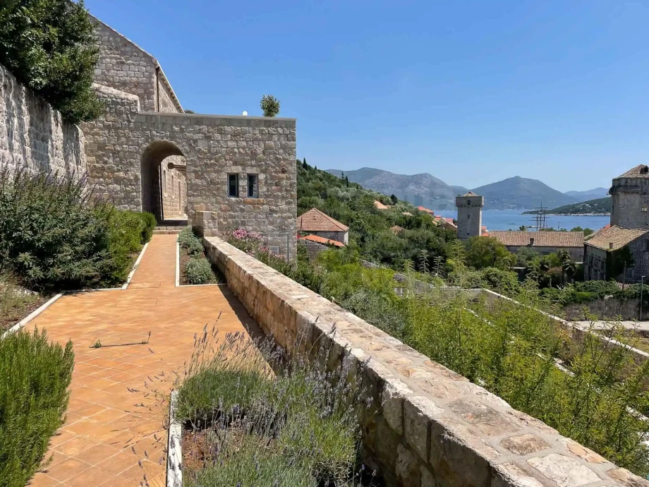 Stone terrace and Mediterranean garden at Villa Ghetaldi with views towards the Adriatic Sea