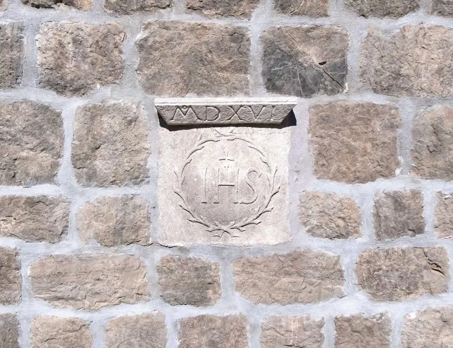 Historic carved stone detail preserved in the walls of villa in Croatia