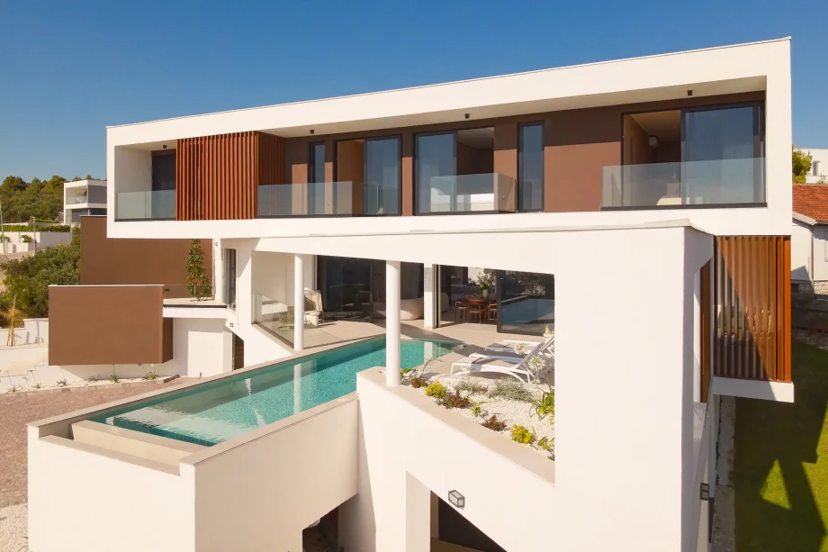 Experience luxury at Villa Serena, a modern villa in Primosten, Croatia, complete with a pool and spacious terrace.