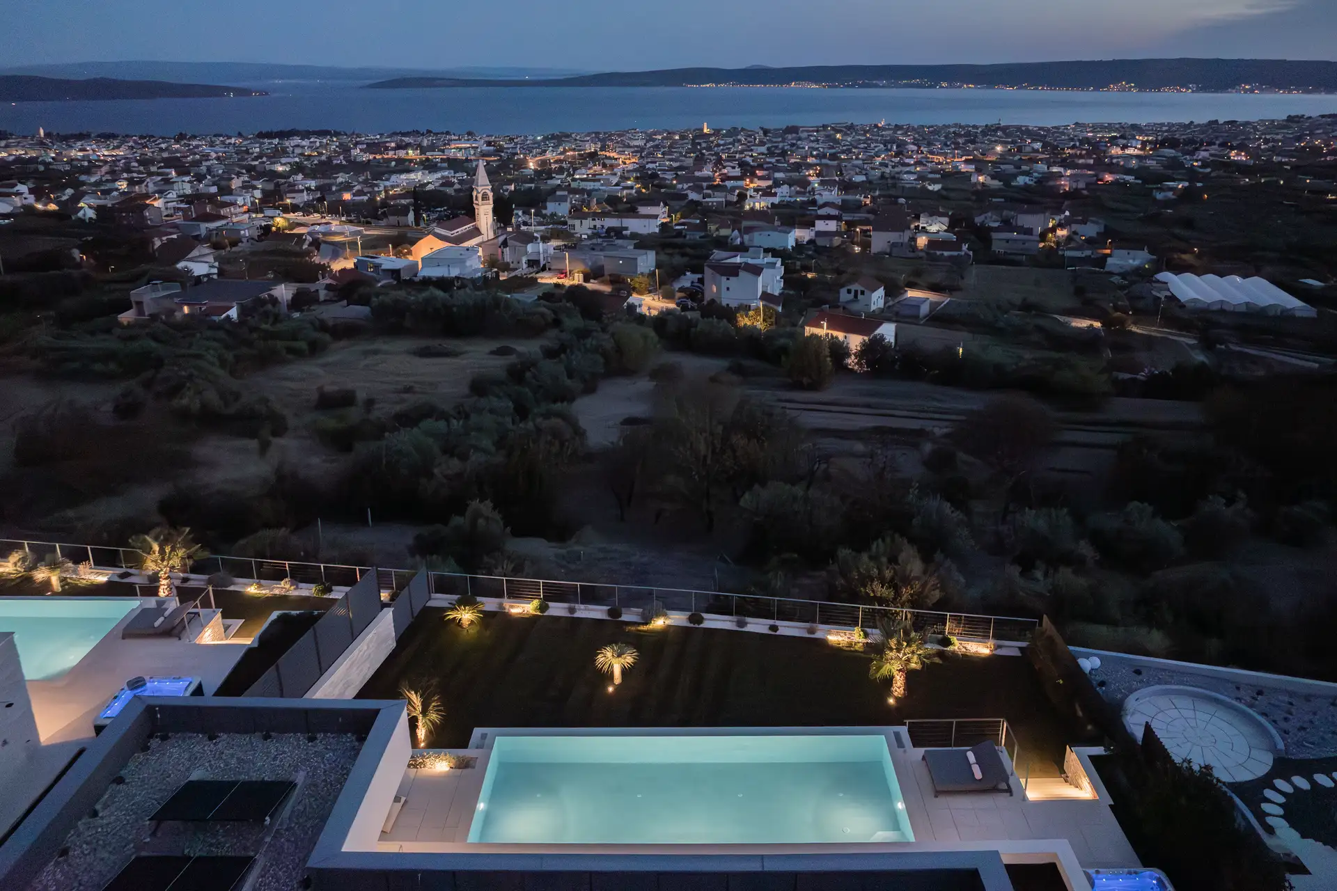 Stunning rooftop view of a luxury villas in Croatia, showing the vibrant coastline and picturesque cityscape.