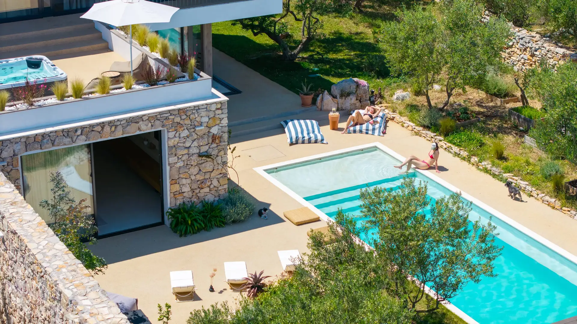 Luxurious Villa Oliveto with a pool and sun loungers, captured from above on Solt Island, Croatia.