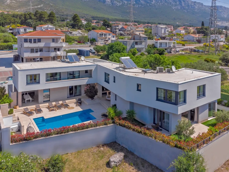 Aerial view of Villa Adria with private pool, sun terrace and landscaped garden in Kaštel Sućurac near Split.
