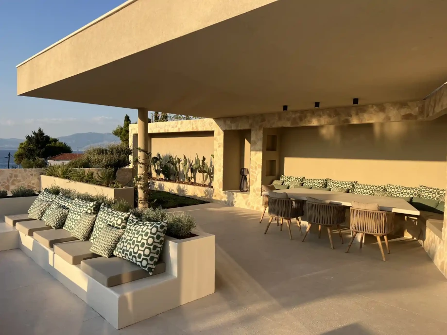 Covered outdoor dining and lounge terrace at Villa Sutivan Horizon on Brač.