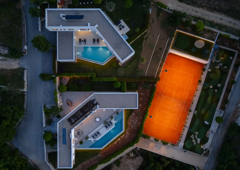 Aerial view of Imota wellness villas with two pools and a private tennis court, ideal for large groups