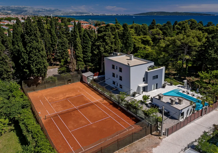 Villa Nobile near Split, with a clay tennis court, heated pool and surrounded by tall cypress trees